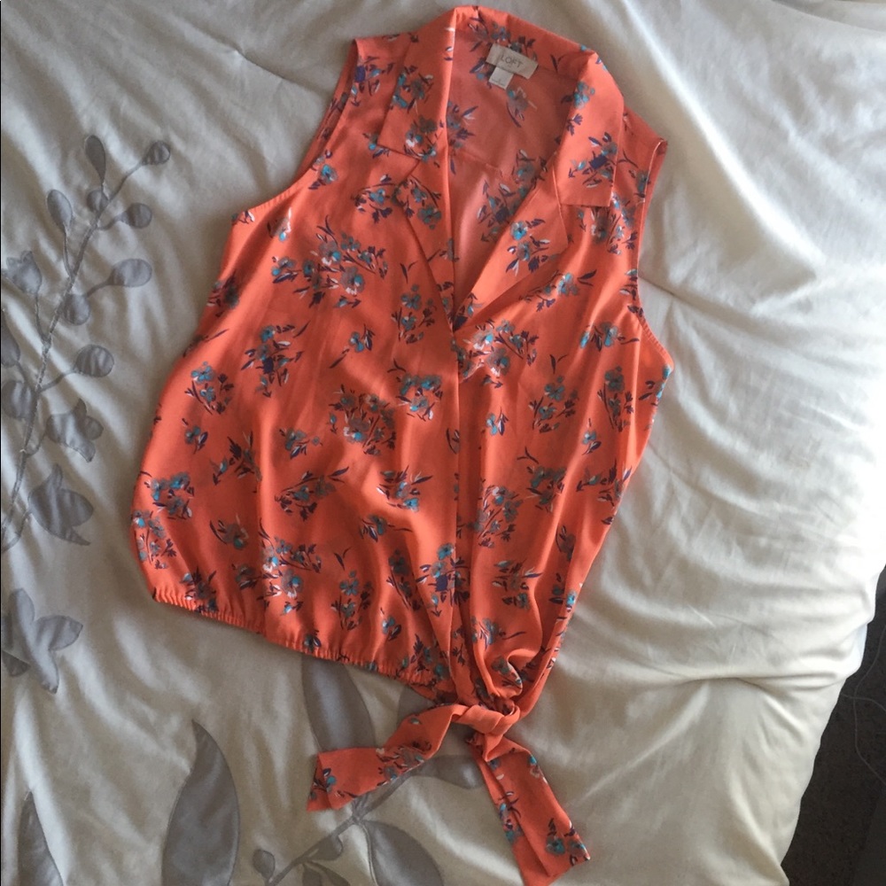Sleeveless orange floral blouse